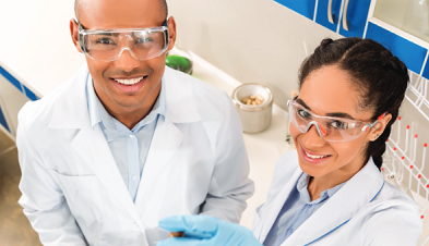 Man and woman in a lab smiling